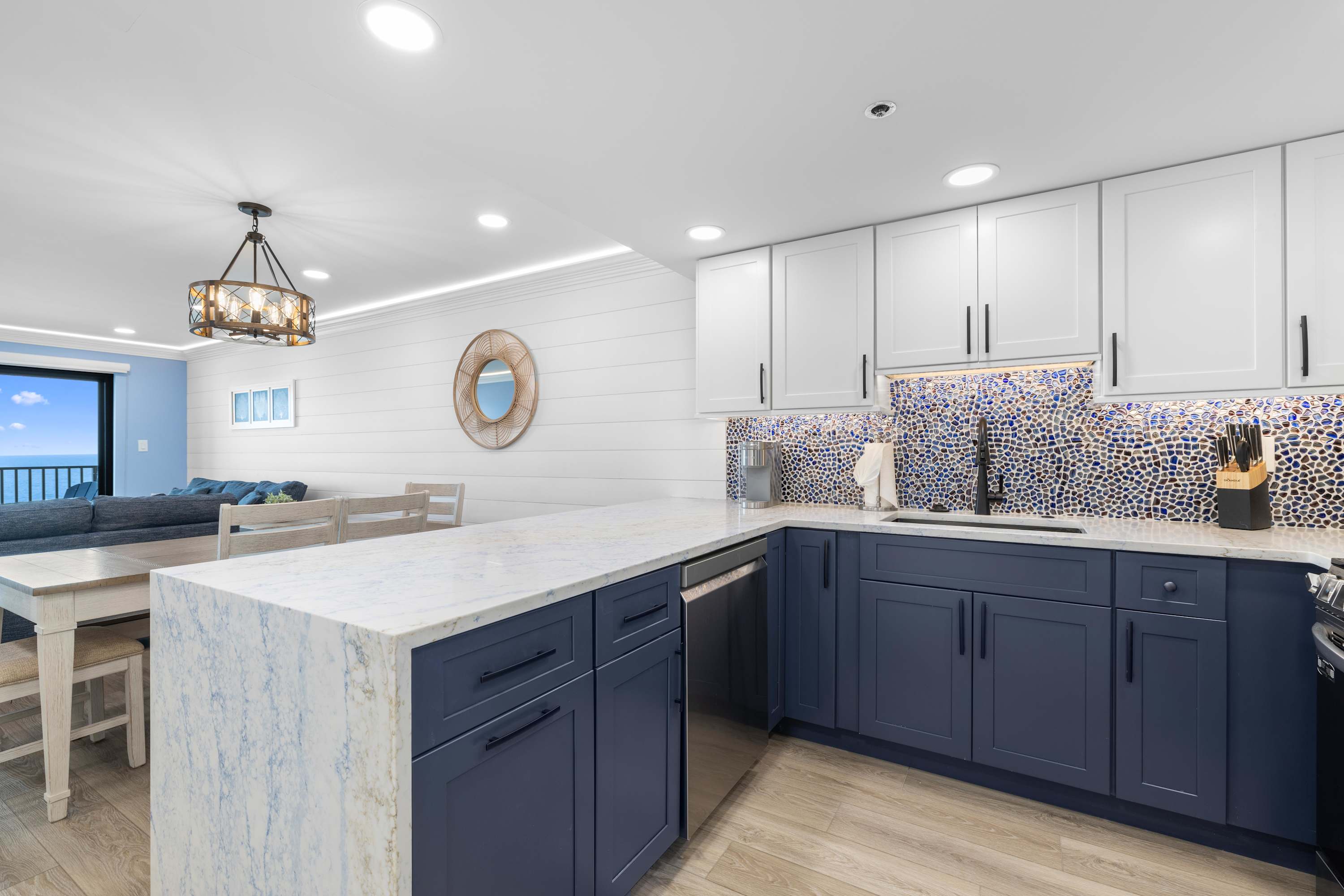 Gourmet kitchen with waterfall-edge peninsula